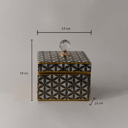 Decorative ceramic jar with geometric black and gold pattern and crystal top shown with 18 cm height and 19 cm width.