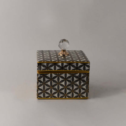 Elegant handcrafted ceramic jar with gold geometric pattern and crystal lid accent ideal for luxury home styling.