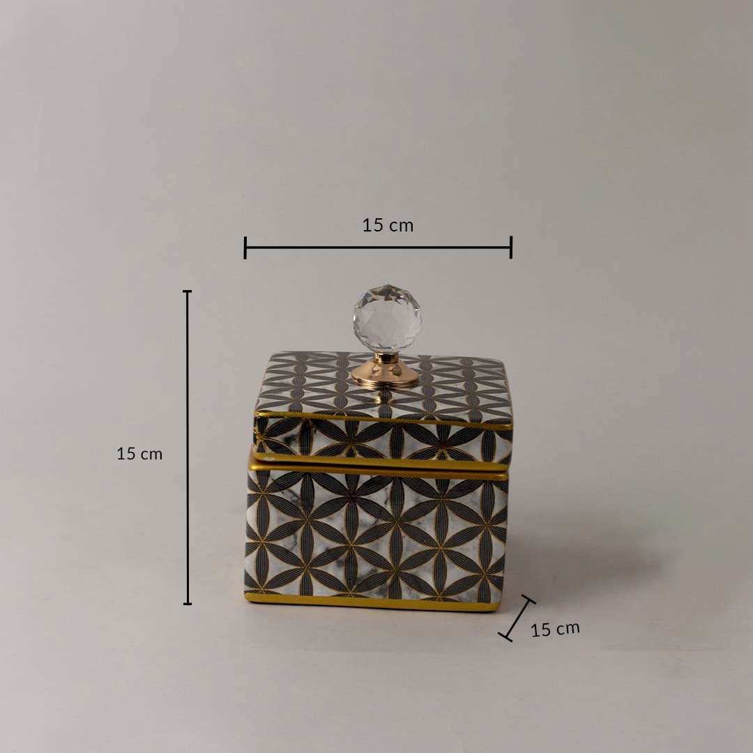 Decorative black and gold ceramic jar with geometric pattern and crystal knob shown with 15 cm height and width.