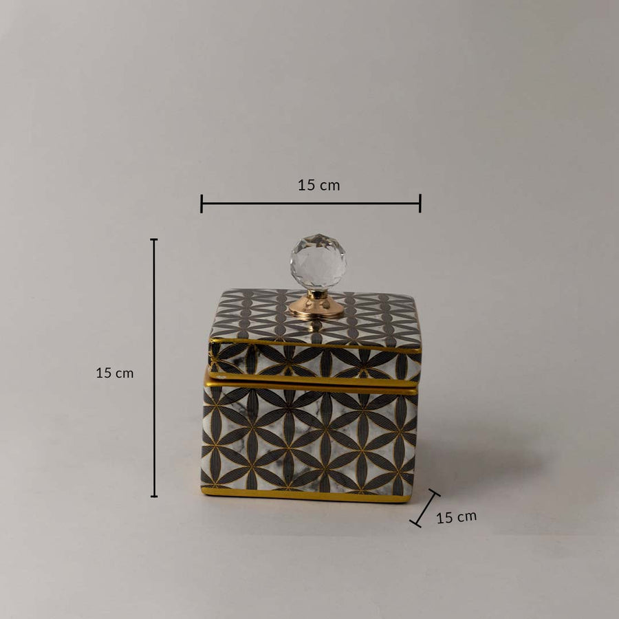 Decorative black and gold ceramic jar with geometric pattern and crystal knob shown with 15 cm height and width.
