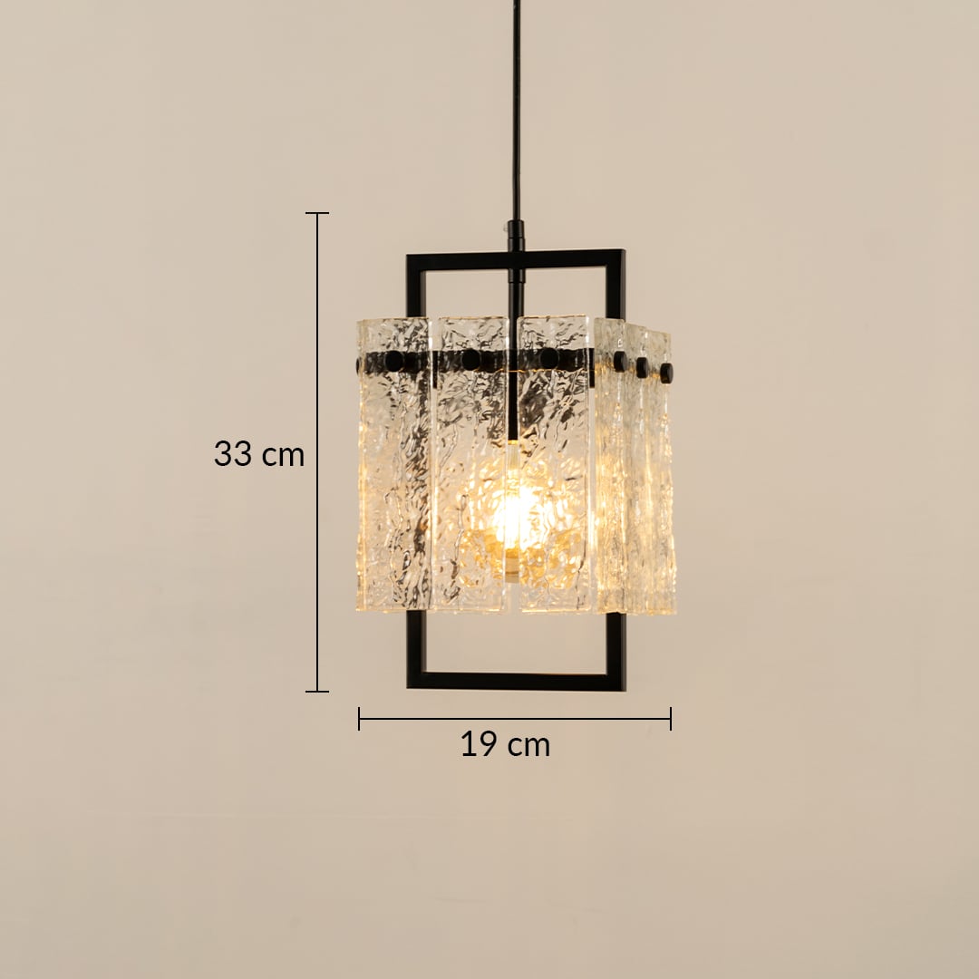 Pendant light with textured glass shade and black metal frame shown with dimensions of 30 cm height and 19 cm width creating a warm patterned glow that enhances the interior.
