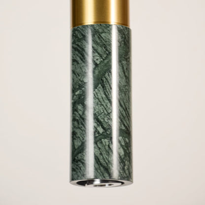 Green marble and gold metal pendant light closeup highlighting natural stone texture and premium craftsmanship.
