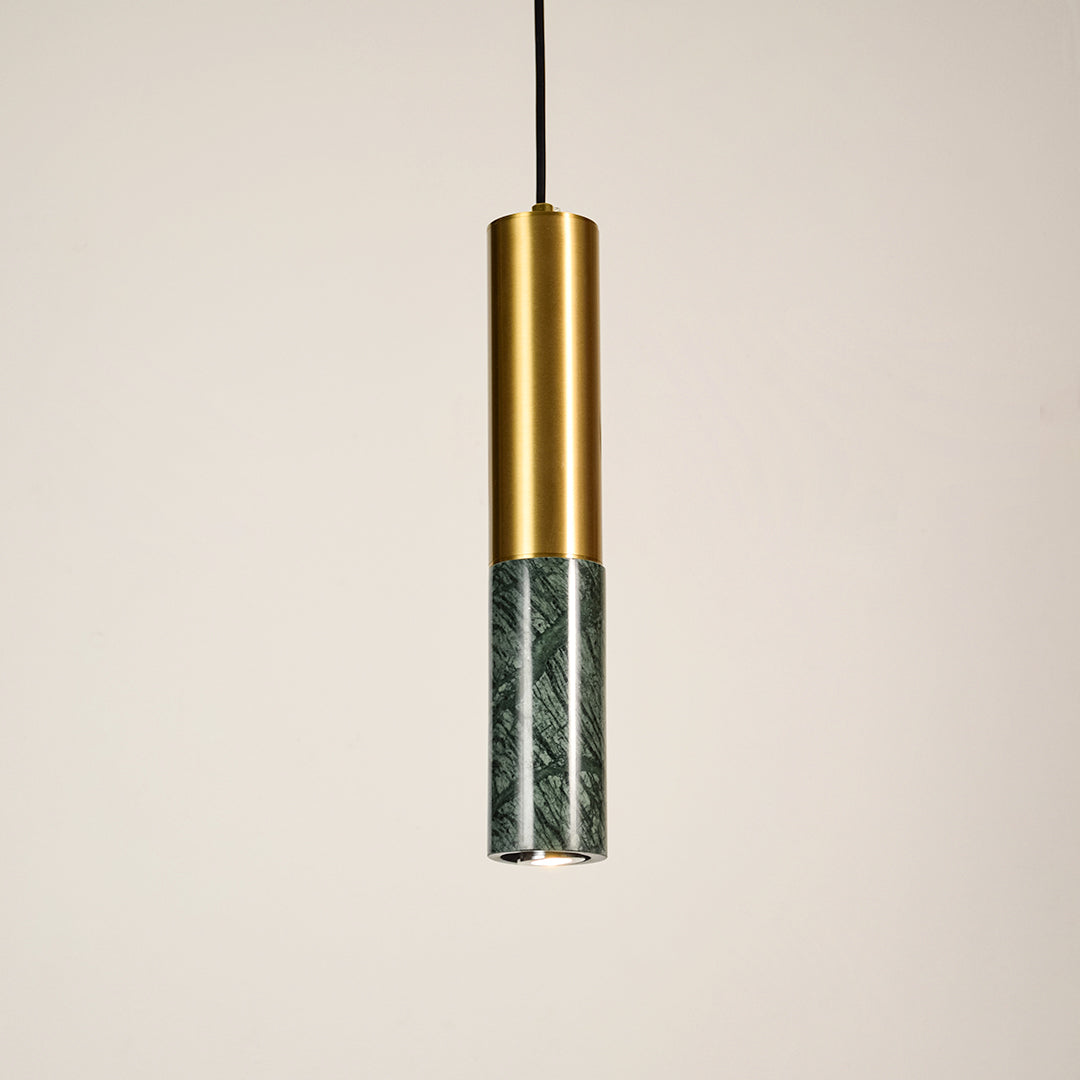 Green marble and gold metal pendant light illuminated to display luxury ceiling lighting with elegant modern styling.