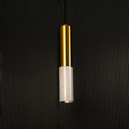 White marble and metal cylinder pendant light hanging against dark textured wall with light off for clean elegant décor.