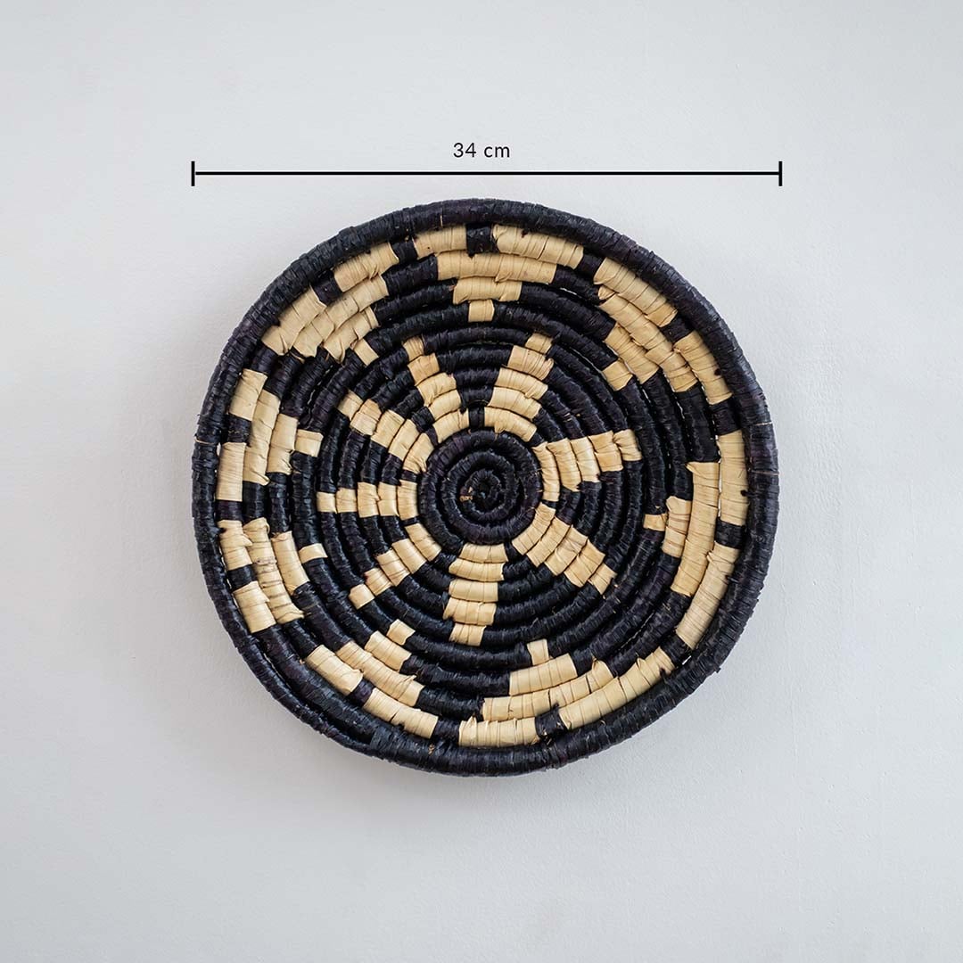 Black cane wall basket with labeled dimensions of 34 cm diameter illustrating size and scale for wall decoration.