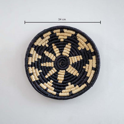 Round handwoven wall basket with geometric black pattern displaying approx 25 cm diameter for modern interior wall decor.