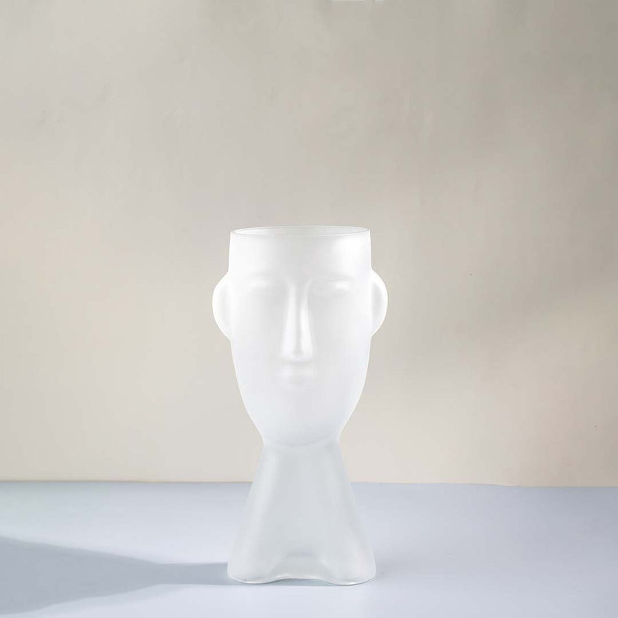 White glass decorative vase with sculptural human face design for shelf styling and contemporary home decor.