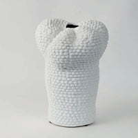 Minimal Pebble vase on a clean white background focusing on its organic curvy silhouette and pebble-inspired ceramic finish.
