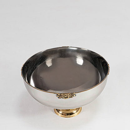 Modern metal bowl in silver finish with gold base for dining table or serving decor accessory placement white background.