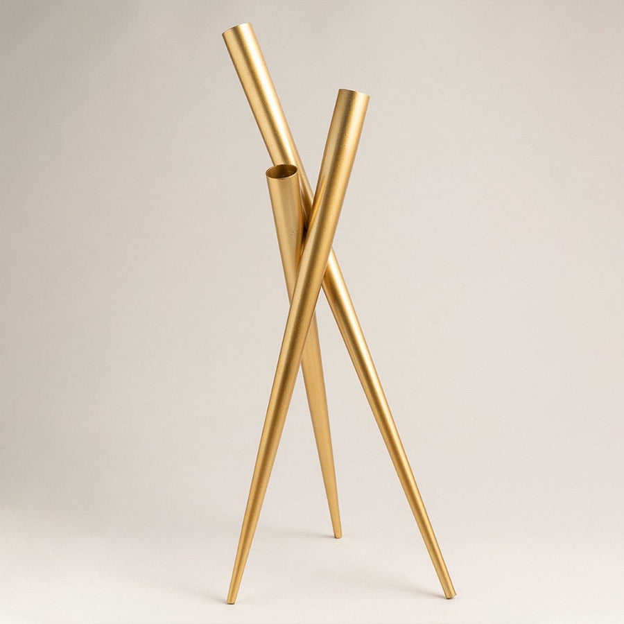 Gold metal vase photographed on a clean white background with soft lighting emphasizing its glossy golden finish and contemporary design for interior decor.