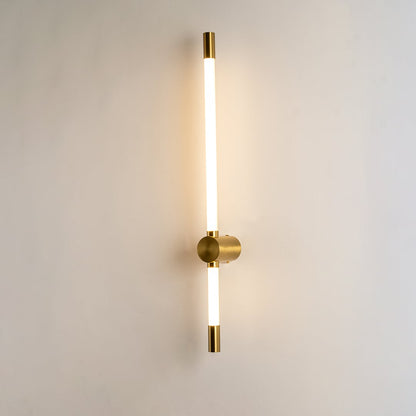 Modern gold LED wall light with warm ambient glow for elegant bedroom and luxury decor styling spaces.

