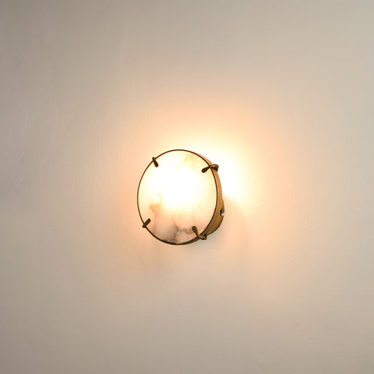 Modern marble wall light with warm ambient glow for elegant hallway and luxury decor styling spaces.