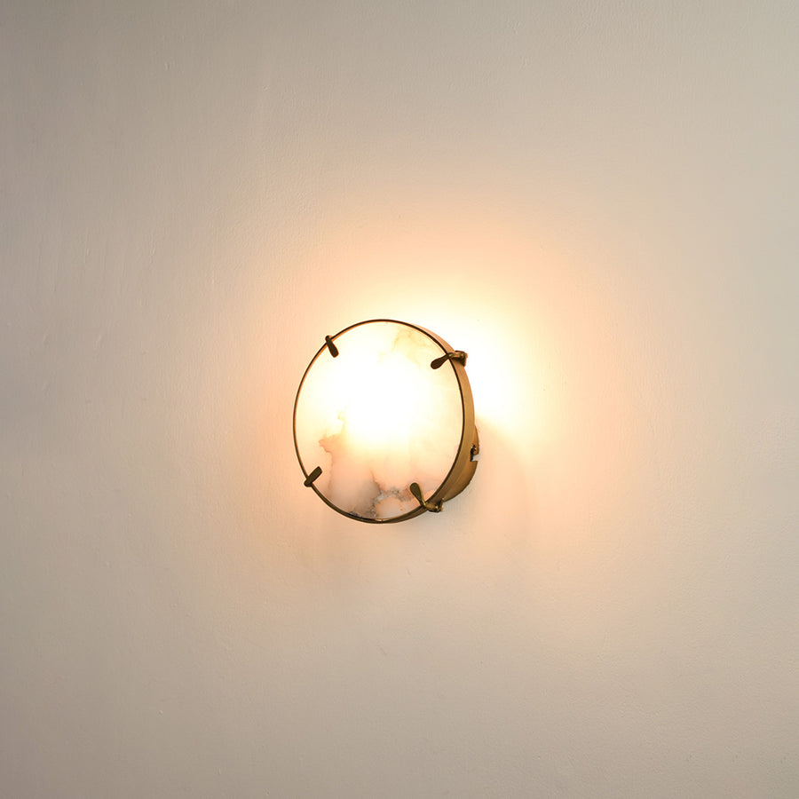Modern marble wall light with warm ambient glow for elegant hallway and luxury decor styling spaces.