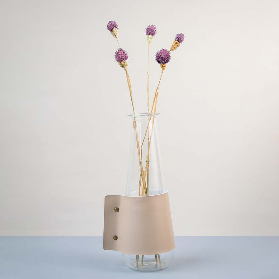 Soft purple dried flower stem styled in a warm modern room adding a gentle natural accent to contemporary home decor.