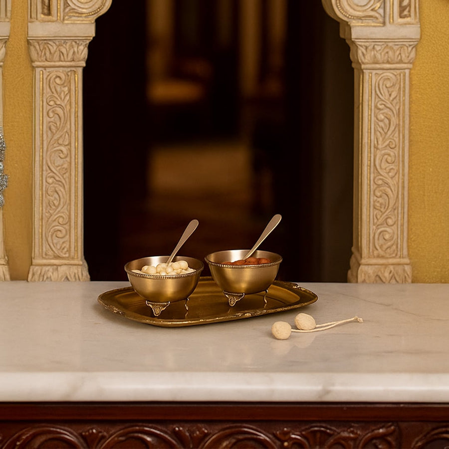 Gold metal condiment bowl set lifestyle image on marble countertop for elegant luxury dining table decor.