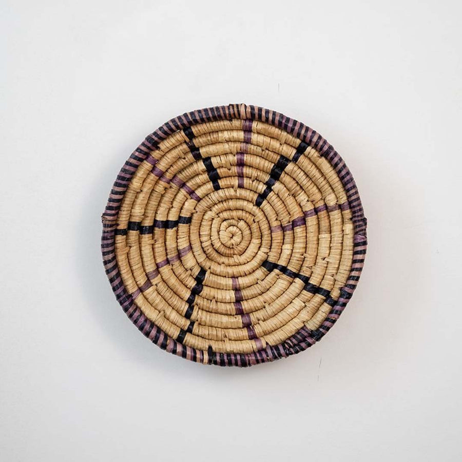Brown and natural woven decorative wall basket with geometric pattern for artistic wall styling and contemporary home decor.