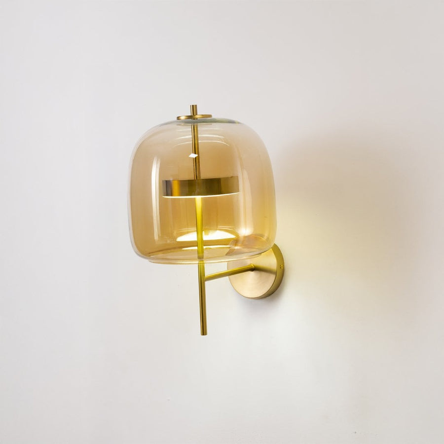 Modern amber glass and gold metal wall light for elegant hallway and contemporary home decor spaces.

