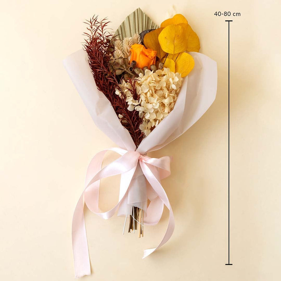 Preserved bouquet size reference 40–80 cm shows arrangement of orange rose yellow leaves hydrangea and pampas grass.