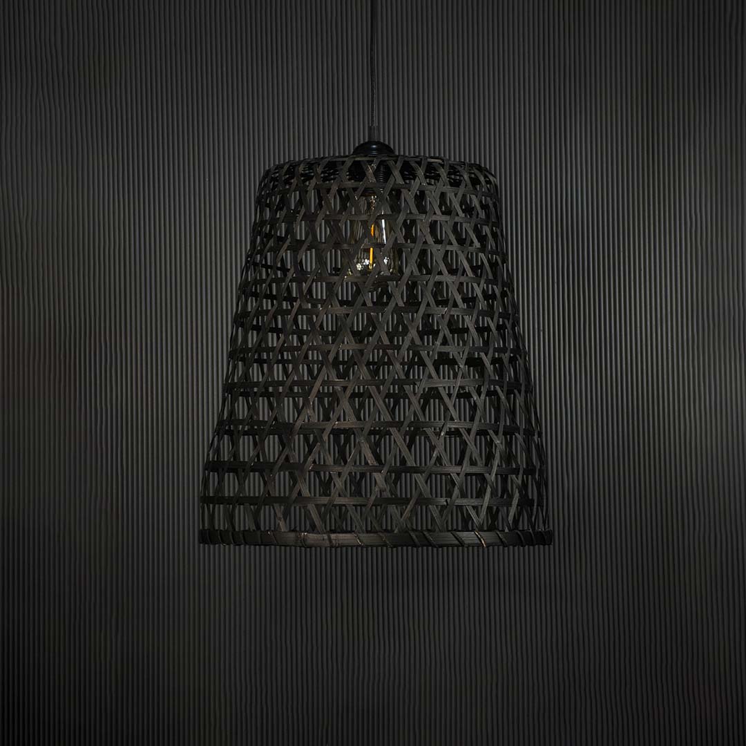 Black bamboo pendant light on dark background highlighting its geometric weave pattern and natural finish.