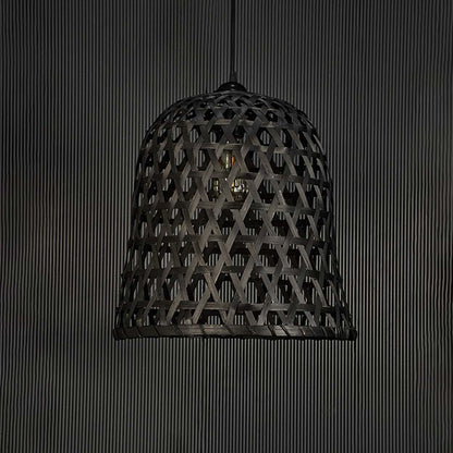 Woven black rattan pendant light on dark background highlighting its handcrafted texture and elegant silhouette.