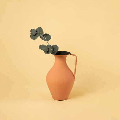 Terracotta metal tall jug vase decor styled in a warm modern room adding an earthy elegant accent to living room tables and corners.