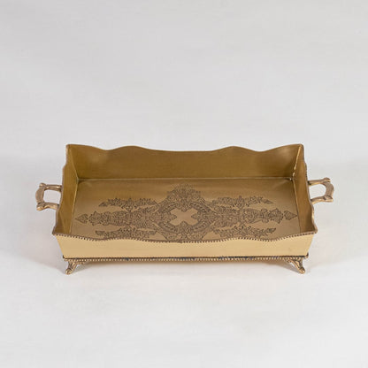 Top view of rectangular brass tray in antique gold with floral engraving and raised handles on white background.