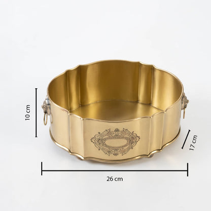 Round gold brass container shown with 30 cm width 12 cm height and 17 cm depth including lion head ring handles.