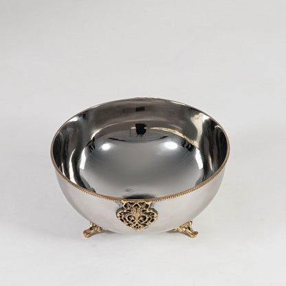 Silver decorative bowl with gold base and center motif shown from front on plain white background for display view.