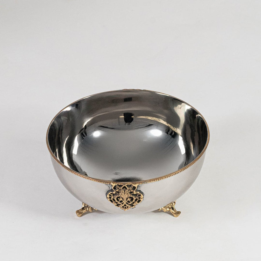 Silver decorative bowl with gold base and center motif shown from front on plain white background for display view.