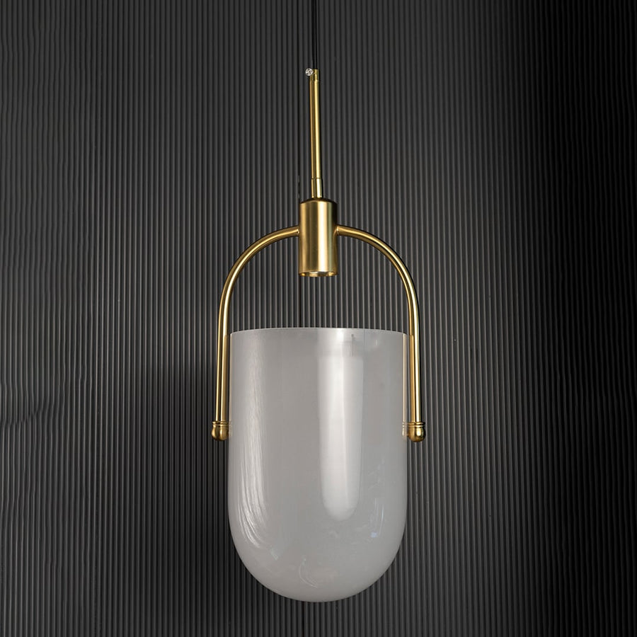 Elegant gold and white pendant light turned off with soft frosted glass shade and metallic gold structure shown against a black background.