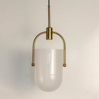 White frosted glass pendant light with gold frame crafted for elegant bedrooms and living spaces.