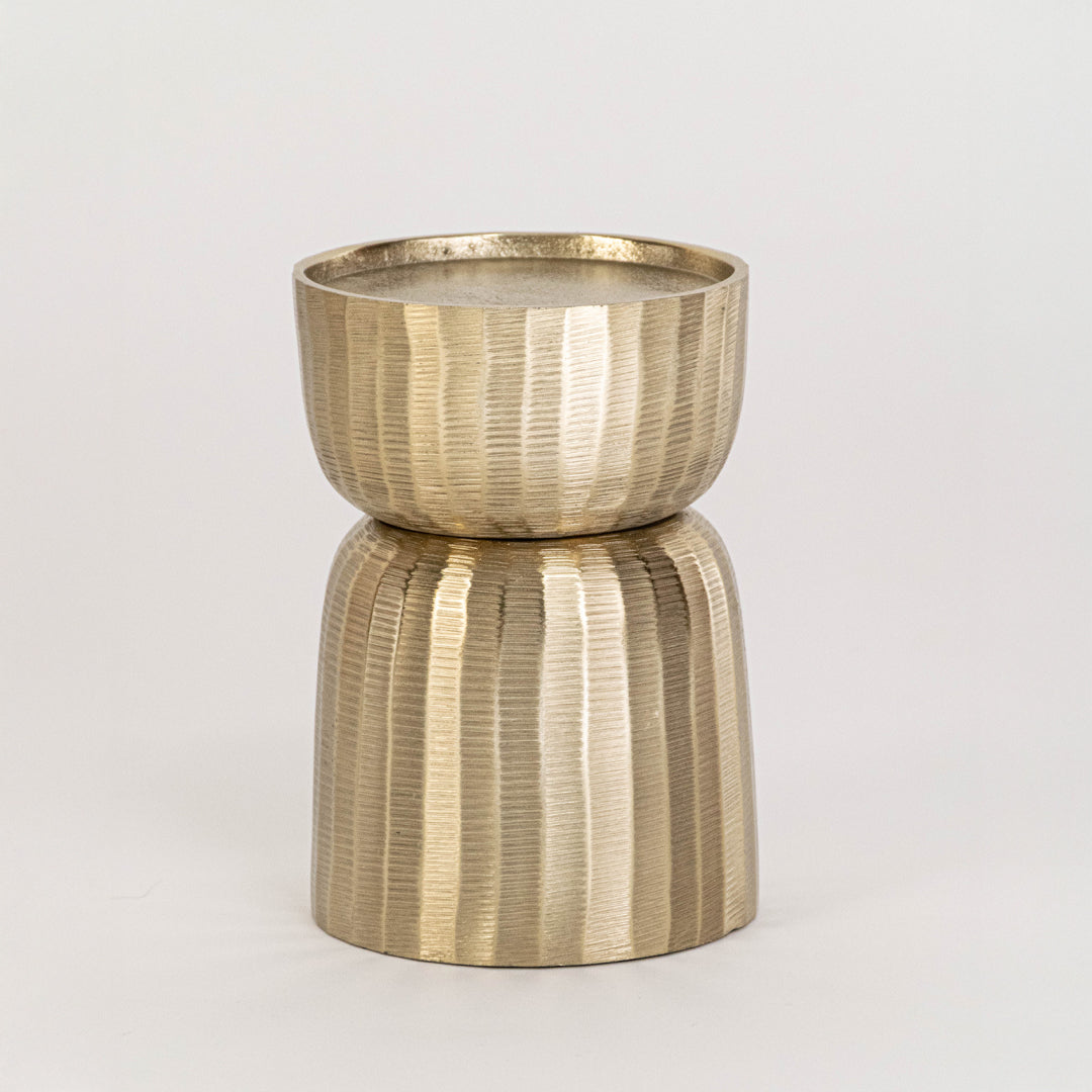 Gold metal decorative candle holder on white background with textured finish for modern tabletop decor.