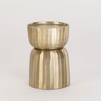 Gold metal decorative candle holder on white background with textured finish for modern tabletop decor.