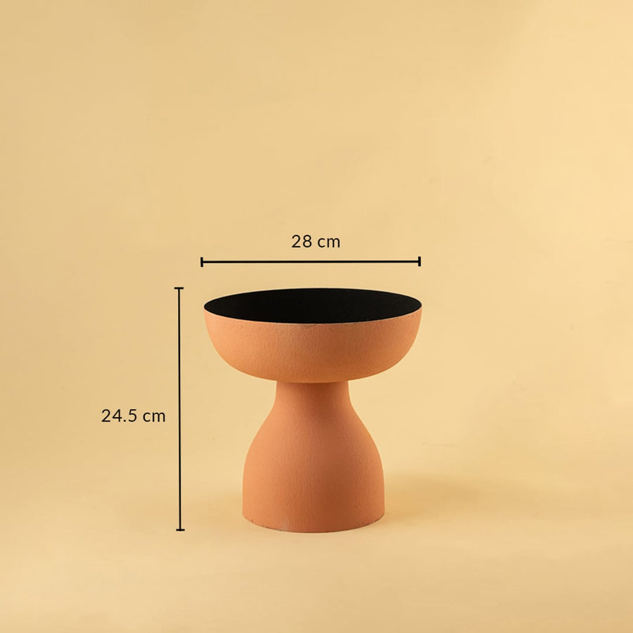 Terracotta orange pedestal bowl with black interior shown with 28 cm width and 24.5 cm height for modern artistic home decor.