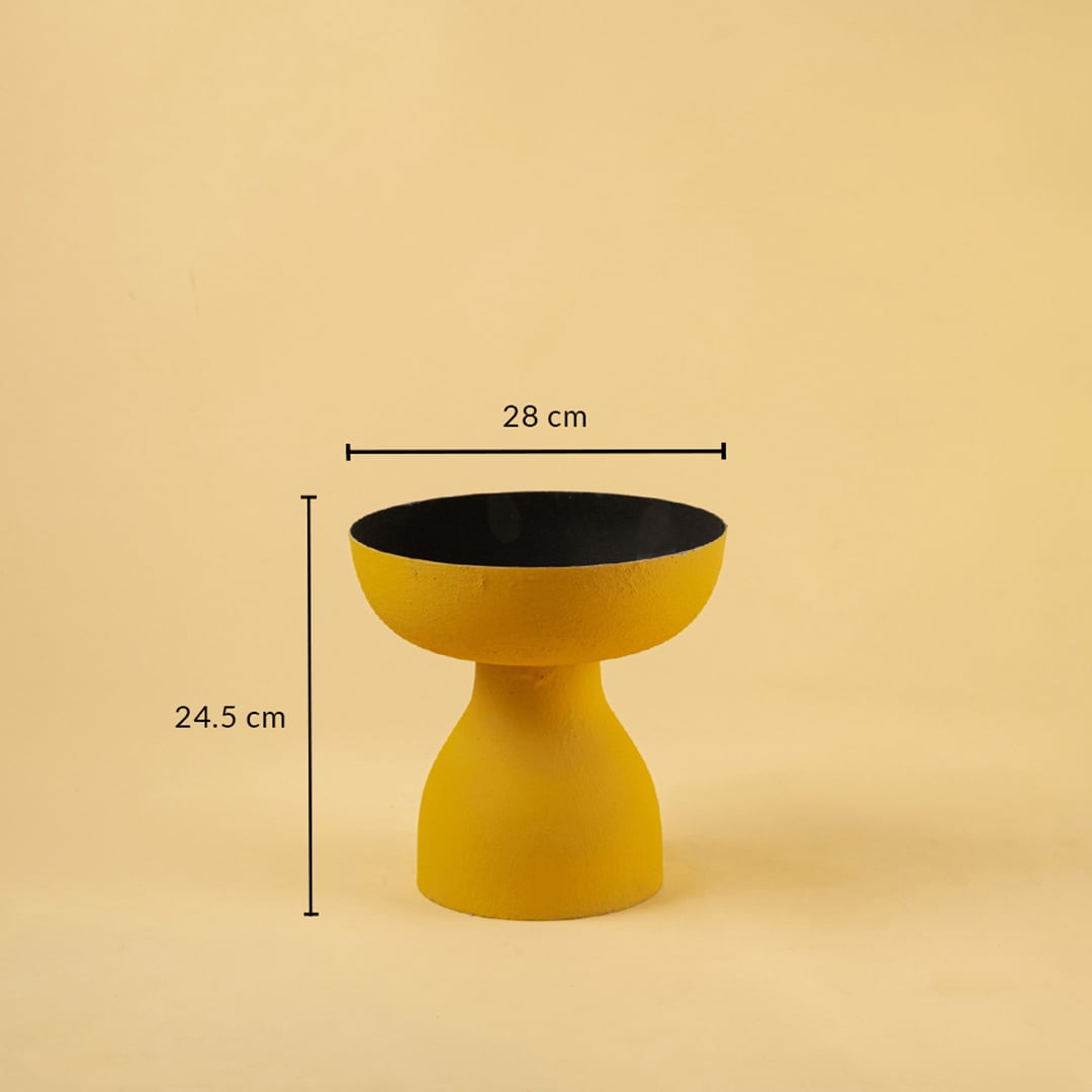 Yellow pedestal bowl with black interior shown with 28 cm width and 24.5 cm height for modern artistic home decor.