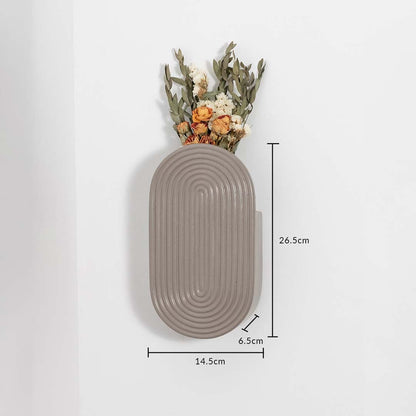 A wall mounted ceramic vase shown with measurements indicating 14.5 cm width 26.5 cm height and 6.5 cm depth for clear and accurate product sizing.