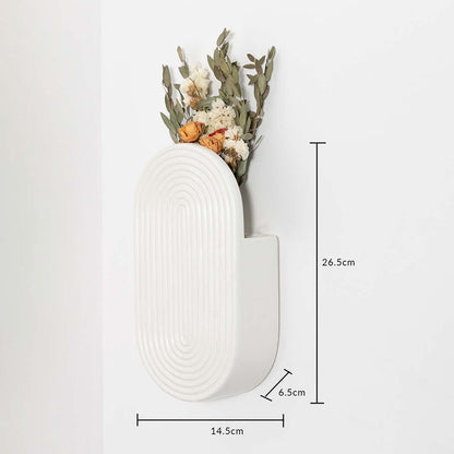 White ceramic wall vase shown with 26.5 cm height 14.5 cm length and 6.5 cm width for accurate decor placement.