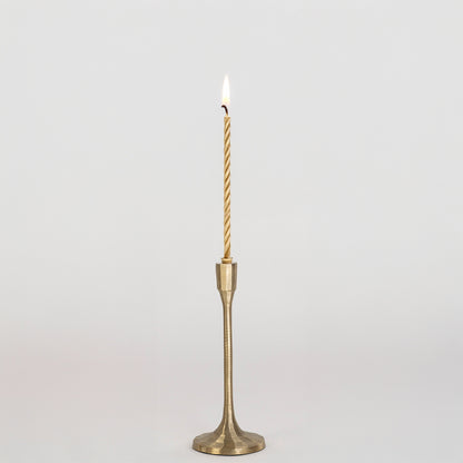 Elegant metal candle holder in gold finish with tall slender design for table decor or dining styling modern home placement white background.