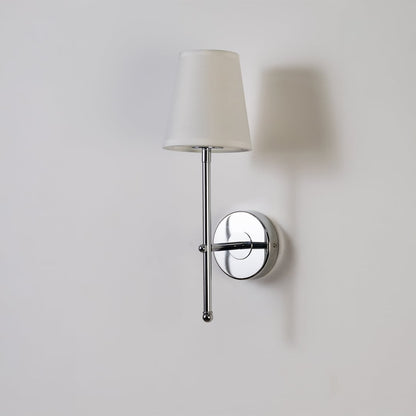 Chrome metal wall light with white fabric shade on bright white background with light off highlighting its minimal modern polished design.