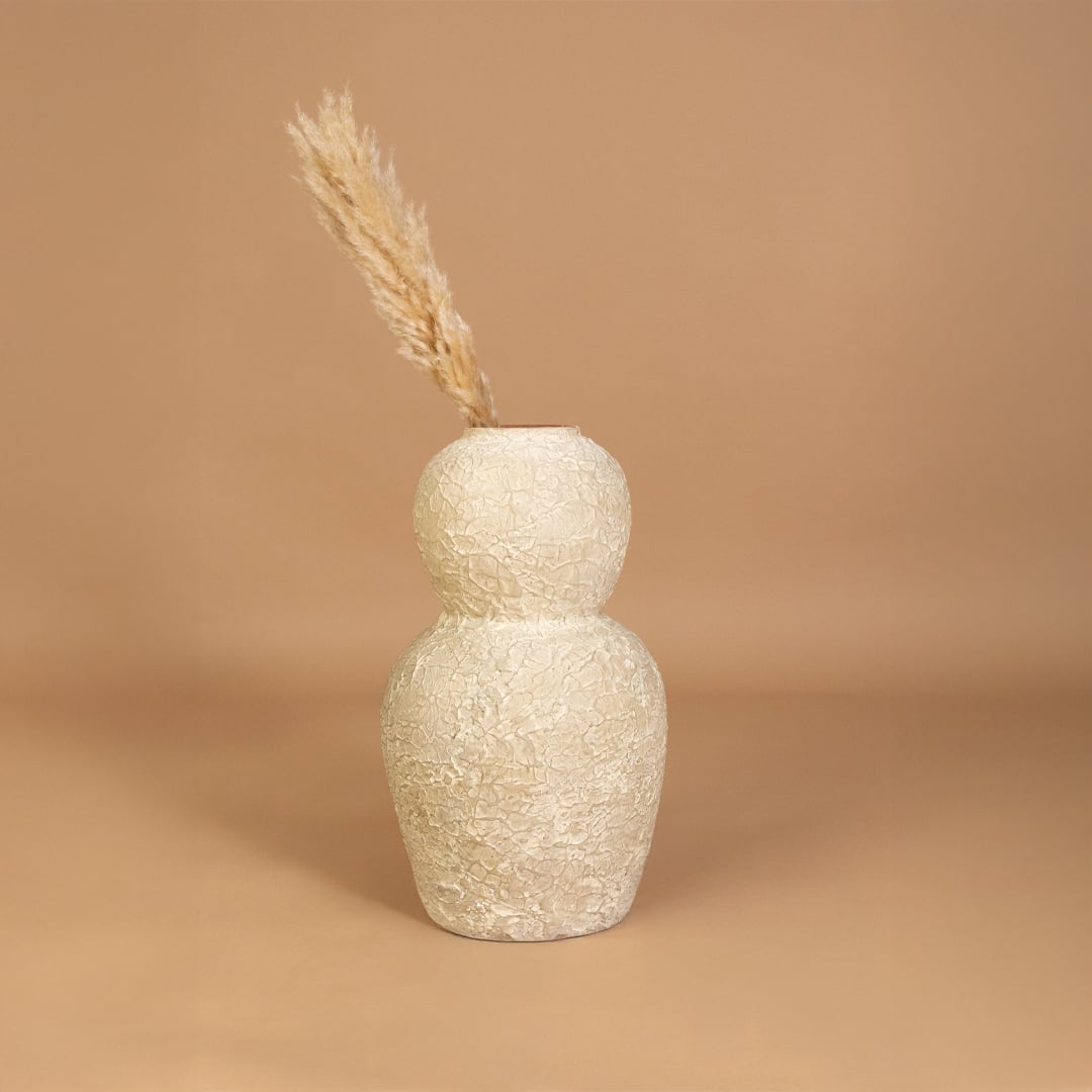 Cream textured decorative vase placed in a curated home setting enhancing shelves consoles and living spaces with natural artistic decor.