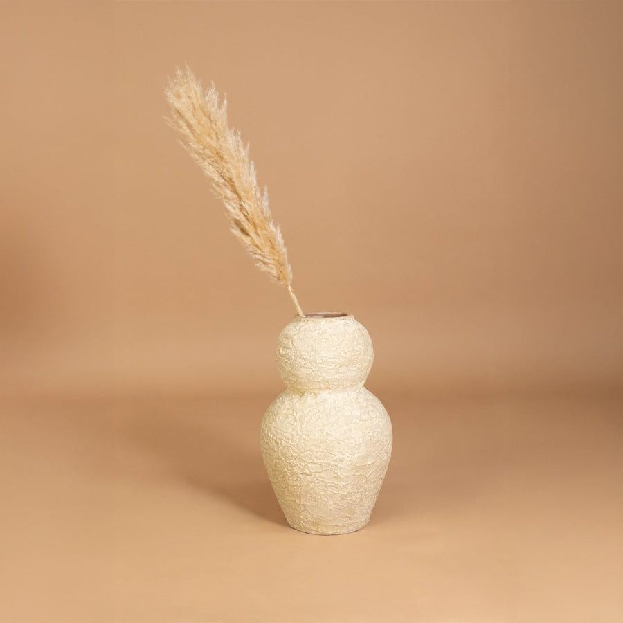 Cream textured decorative vase placed in a curated room setting enhancing shelves consoles and living spaces with natural artistic decor.
