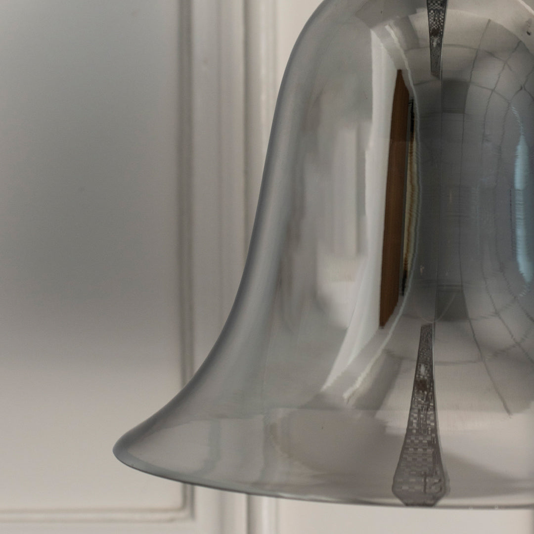 Detailed view of smoky glass pendant light with flared shade showcasing premium finish and timeless design.