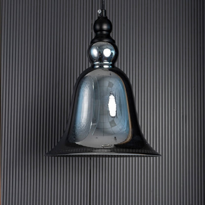 Sleek smoke grey glass hanging light fixture turned off isolated on a pitch black background for a dramatic high contrast look.