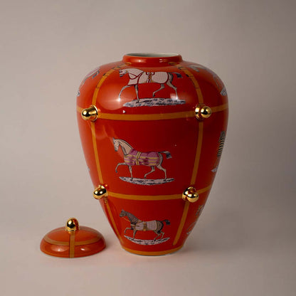 White background image of ceramic ginger jar with orange finish gold knobs horse motifs 40x30cm decor vase.