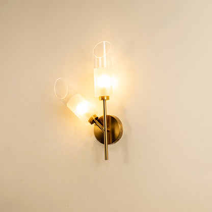 Modern gold metal wall light with clear glass shade for elegant hallway and luxury decor styling spaces.