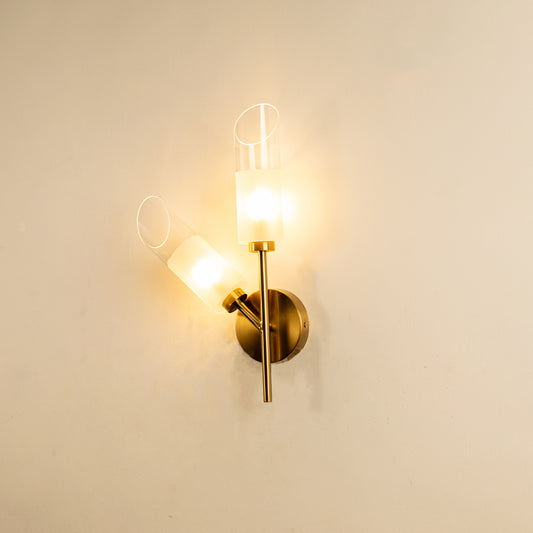 Modern gold metal wall light with clear glass shade for elegant hallway and luxury decor styling spaces.