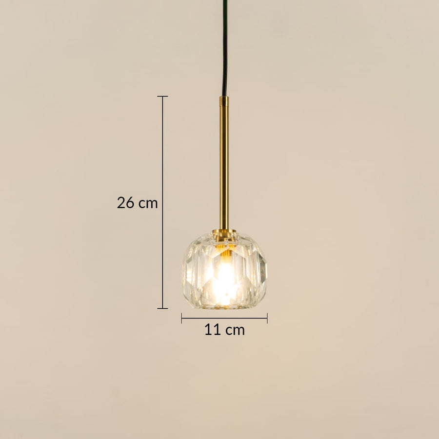 Dimension image of faceted clear glass pendant light with brass stem showing 26 cm height and 11 cm width.