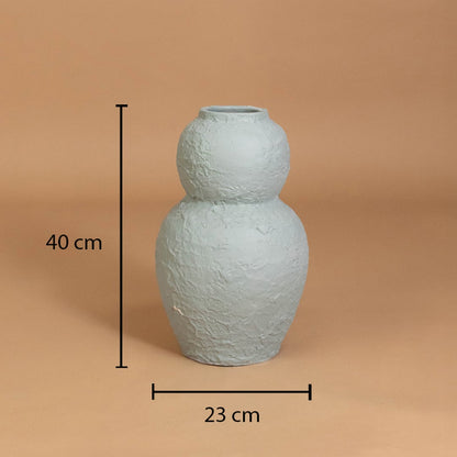 Light blue textured decorative vase shown with 40 cm height and 23 cm width for accurate placement in modern home interior decor settings.
