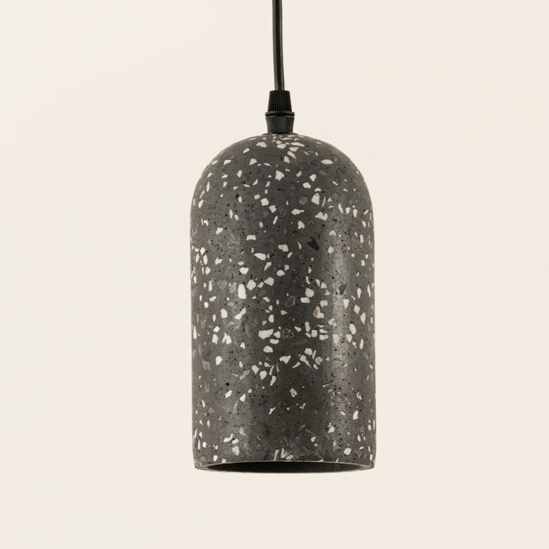 Detailed view of black terrazzo pendant light showcasing premium stone texture and elegant design.