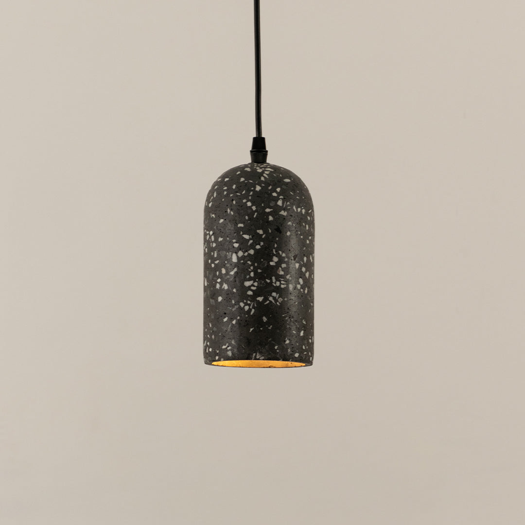 Black terrazzo pendant light with white speckled finish crafted for modern living spaces.